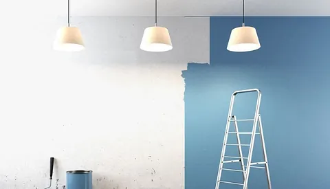 Painted commercial room with ladder and paint tins