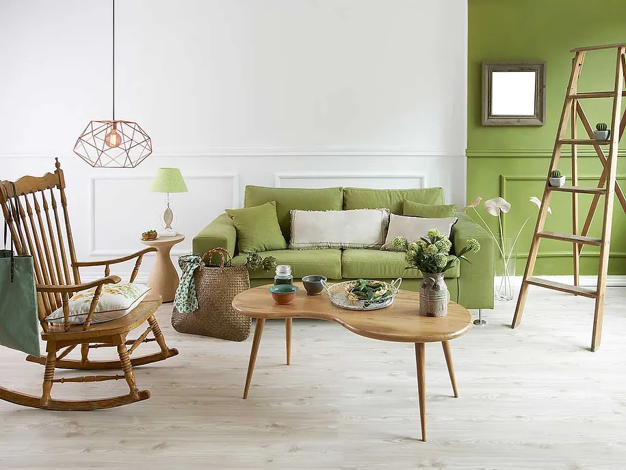 Living room with a green painted feature wall