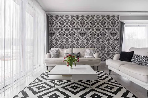 Living room with grey patterned wallpaper